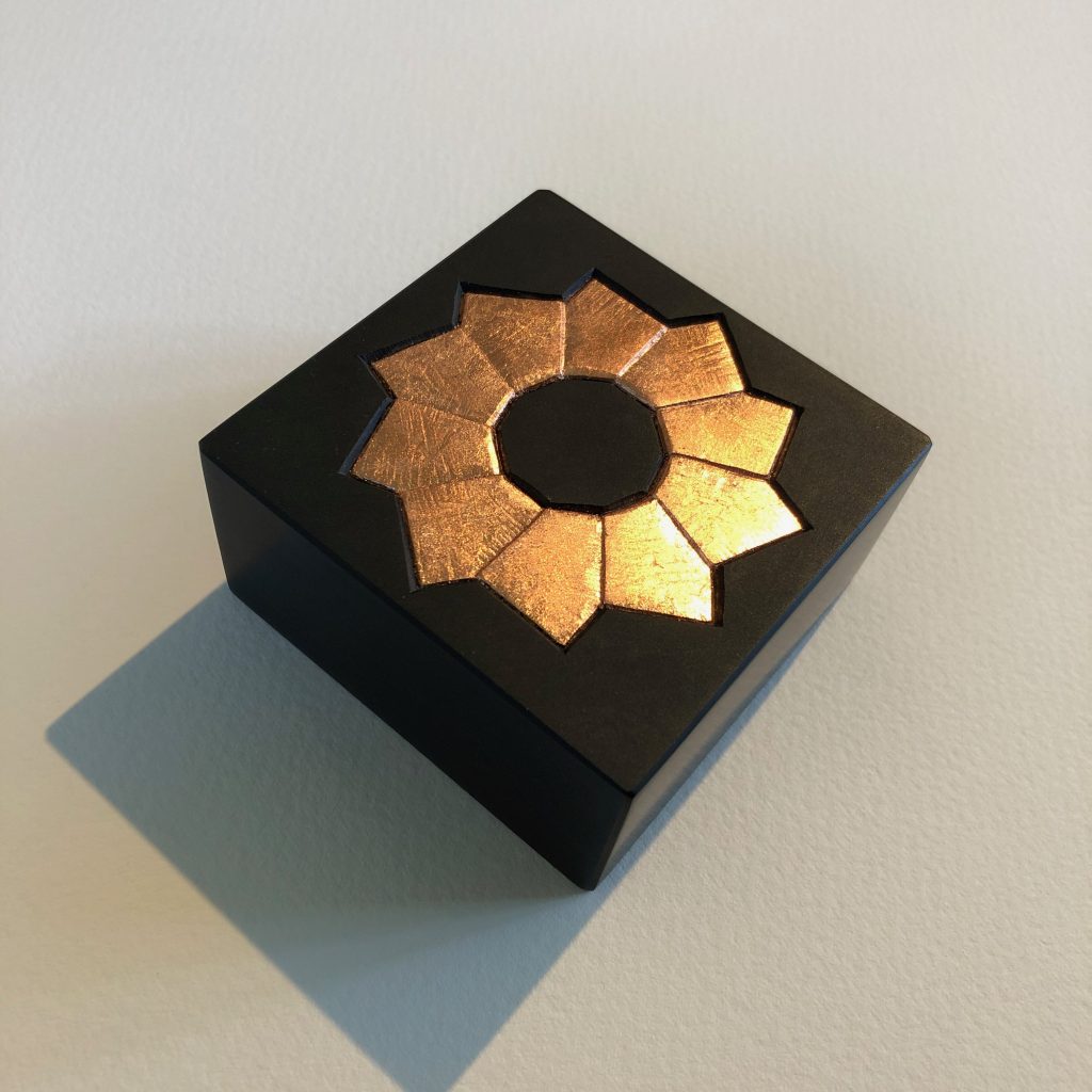 Paperweight, Welsh slate, with carved paper star with copper leaf finish.