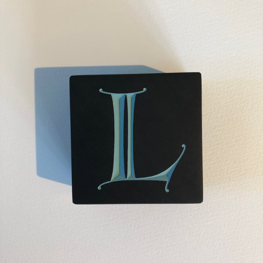 Paperweight, Welsh slate, v-cut and painted.